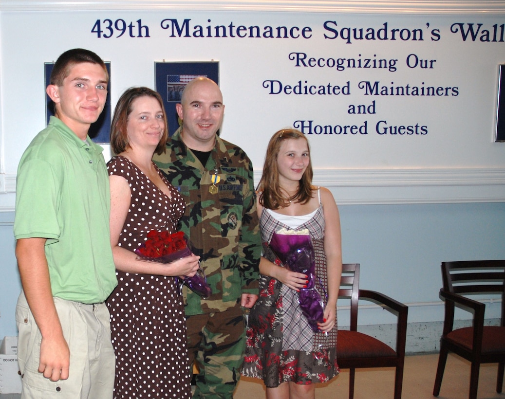 Technical Sgt. Robert Deluca retired Saturday, June 26, 2010, after more than 20 years in the Air Force Reserve. He was joined by his wife and two children, as well as other family members and Airmen from the 439th Maintenance Squadron. (Air Force Photo/Staff Sgt. Andre Bowser)