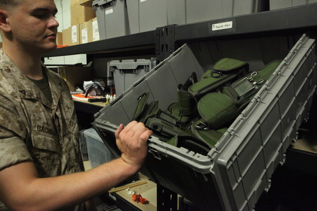 Lance Cpl. Jacob Bachman, an electronic ordnance repairman with the Headquarters and Support Battalion armory, Marine Corps Base Camp Lejeune, counts a crate of pistol holsters to prepare for an upcoming annual inspection, recently. Bachman is one of four Marines at the armory that takes part in keeping accountability of things like weapons, paperwork and gear.