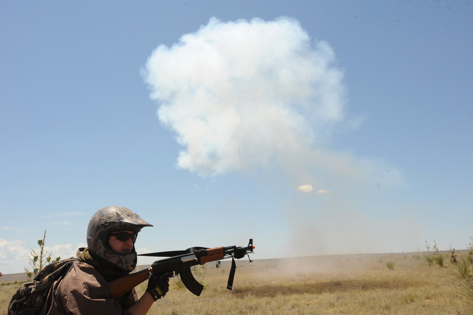 U.S. Air Force Staff Sgt. Kirk Baerlocher, 551st Special Operations Squadron, keeps watch as ground burst simulators explode all around during a Capabilities Exercise, June 26, 2010. The CAPEX gave insight into Cannon Air Force Base's mission and capabilities. (U.S. Air Force Photo by Airman 1st Class Maynelinne De La Cruz)  