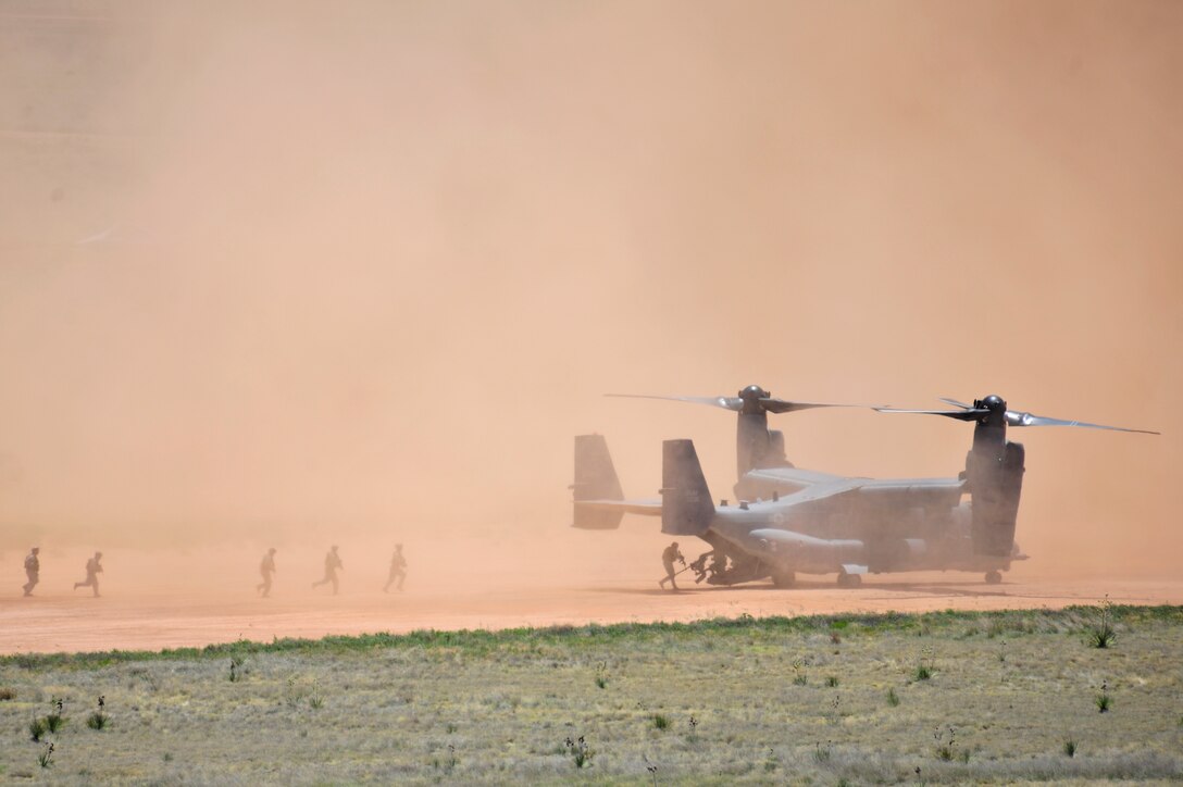 A CV-22 Osprey, flown by the 20th Special Operations Squadron exfiltrates a special operations team during a Capabilities Exercise, June 26, 2010. The CAPEX  at Melrose Air Force Range educated base employees and their families about the mission and capabilities of the 27th Special Operations Wing at Cannon Air Force Base, N.M.  (U.S. Air Force Photo by Tech. Sgt. Josef Cole)