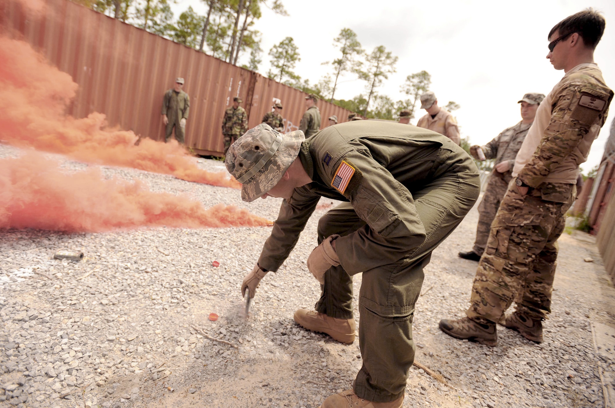 An Airman participating in survival, evasion, resistance, and escape training, prepares to set off a flare during combat skills training at the Eglin Air Force Base, Fla., range May 13, 2010. (U.S. Air Force photo/Senior Airman Matthew Loken)