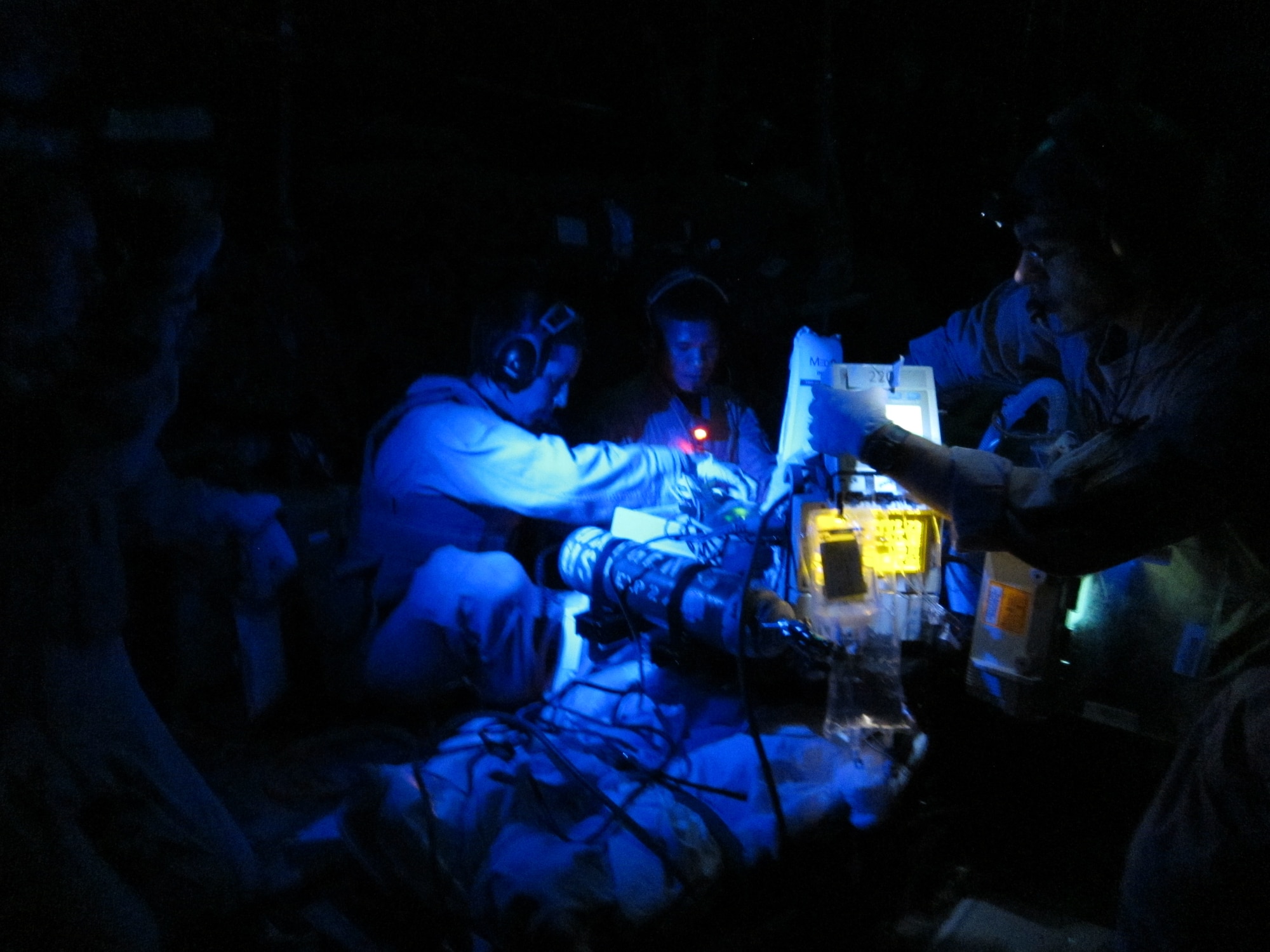 Members from the 451st Expeditionary Aeromedical Evacuation detachment in Camp Bastion, Afghanistan operate in a HC-130P model Special Operations Search & Rescue fixed wing in an attempt to save two pararescumen June 9. (U.S. Photo/Courtesy)