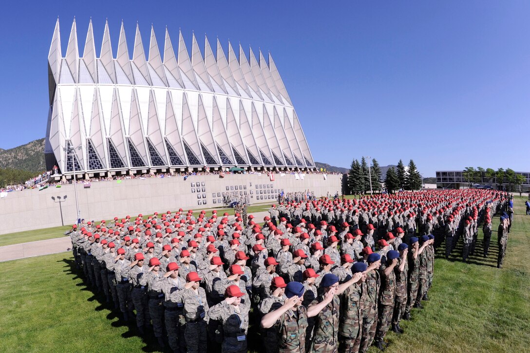 Cadet cadre and Class of 2014 basic cadets salute during the playing of the "Star-Spangled Banner" as part of a swearing-in ceremony June 25, 2010, at the U.S. Air Force Academy, in Colorado Springs, Colo.  The ceremony marks their first full day of basic cadet training which will continue through July 31. (U.S. Air Force photo/Mike Kaplan)