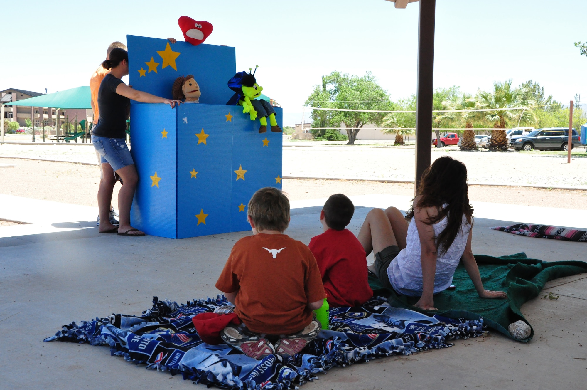 HOLLOMAN AIR FORCE BASE, N.M. -- Volunteers from Holloman perform a puppet show for the children who attended the Special Kids Day hosted by the Airman and Family Readiness Center and Exceptional Family Member Program at Steinhoff Park June 12, 2010. The event was held for family's with children with special needs and featured carnival games, face painting, a petting zoo and pony rides. (Courtesy photo / Released)