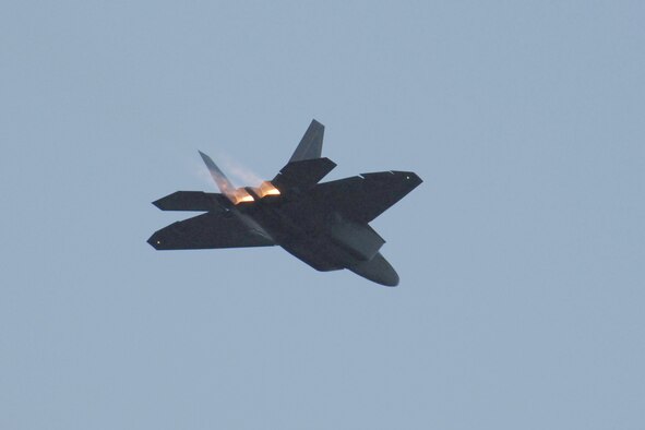 An F-22 Raptor flies over the National Museum of the U.S. Air Force June 25, 2010, during Air Force Materiel Command's sixth annual Freedom's Call Tattoo. The free event attracted about 75,000 people from communities neighboring Wright-Patterson Air Force Base, Ohio. (U.S. Air Force photo/Ben Strasser) 