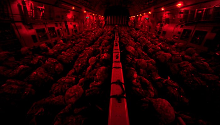 U.S. Soldiers from the 82nd Airborne Division, Fort Bragg, N.C., sit onboard a C-17 Globemaster III cargo aircraft based at Joint Base Charleston, S.C., as they travel to their destination to perform a nighttime aerial insertion during a joint forcible entry exercise June 22, 2010. (U.S. Air Force photo/Staff Sgt. Angelita M. Lawrence)