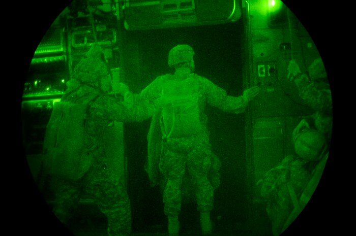 U.S. Army jumpmasters from the 82nd Airborne Division, Fort Bragg, N.C., prepare for a nighttime aerial insertion from a C-17 Globemaster III cargo aircraft based at Joint Base Charleston, S.C., during a joint forcible entry exercise June 22, 2010. JFEX is a week-long exercise conducted six times a year to enhance cohesion between the Army and Air Force through large-scale heavy equipment and troop movements. (U.S. Air Force photo/Staff Sgt. Angelita M. Lawrence)