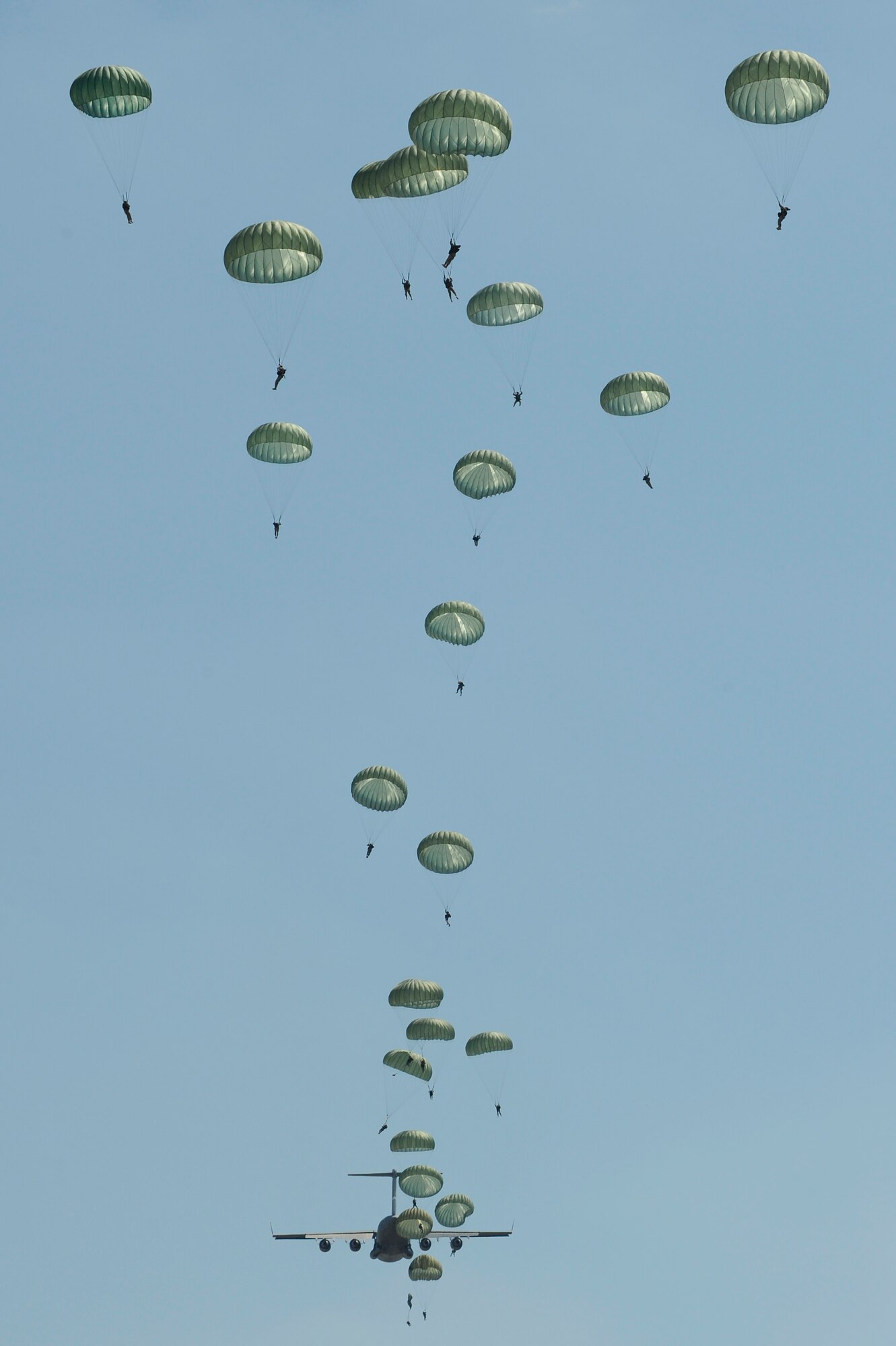 U.S. Army paratroopers from the 82nd Airborne Division, Fort Bragg, N.C., jump from a C-17 Globemaster III cargo aircraft during a joint forcible entry exercise June 21, 2010. The purpose of the JFEX is to re-establish forcible entry capability through air power by combining Army and Air Force training needs. (DoD photo/Tech. Sgt. Tony Tolley/U.S. Air Force)