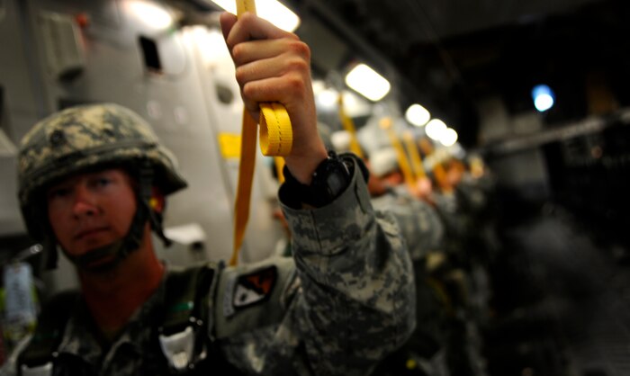 U.S. Army Staff Sgt. Christopher Emmons, with the 330th Movement Control Battalion, 647th Quartermaster Company, Fort Bragg, N.C., prepares to perform an airborne insertion from a C-17 Globemaster III cargo aircraft based at Joint Base Charleston, S.C., during a joint forcible entry exercise June 21, 2010. JFEX is a week-long exercise conducted six times a year. (U.S. Air Force photo/Staff Sgt. Angelita M. Lawrence)