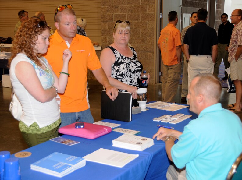 Staff Sgt. Katie Basiliere, left, and Tech Sgt. William Baker, both Airmen with the 188th Fighter Wing, visit various stations to learn about resources available for military members who have recently deployed. The 188th hosted a Yellow Ribbon Reintegration event at the Fort Smith (Ark.) Convention Center June 26-27. The Air National Guard unit returned last May from an Aerospace Expeditionary Forces deployment to Kandahar Airfield in Afghanistan. The event also featured classes on key topics facing servicemembers following deployment. (U.S. Air Force photo by Tech Sgt. Stephen Hornsey/188th Fighter Wing Public Affairs)