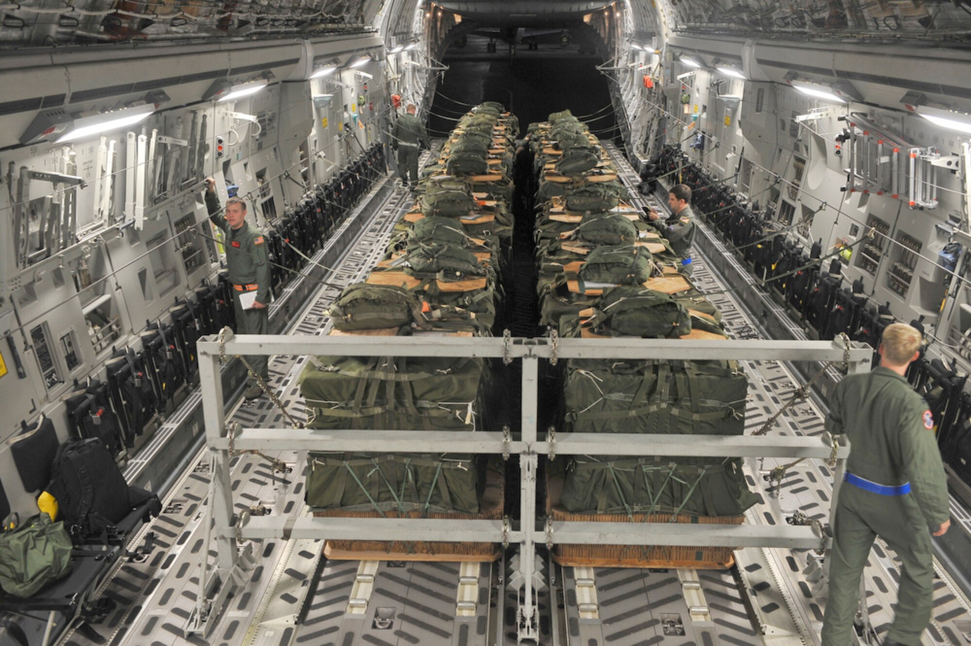 Crewmembers from the 535th Airlift Squadron verify that their cargo and C-17 Globemaster III are ready for takeoff so they may conduct an airdrop as part of the Rim of the Pacific exercise June 24, 2010, at Joint Base Pearl Harbor-Hickam, Hawaii. This is the 22nd year of the biennial exercise and it stresses the interoperability of more than 14 partner nations as a key element of regional stability. (U.S. Air Force photo/Tech. Sgt. Cohen A. Young) 