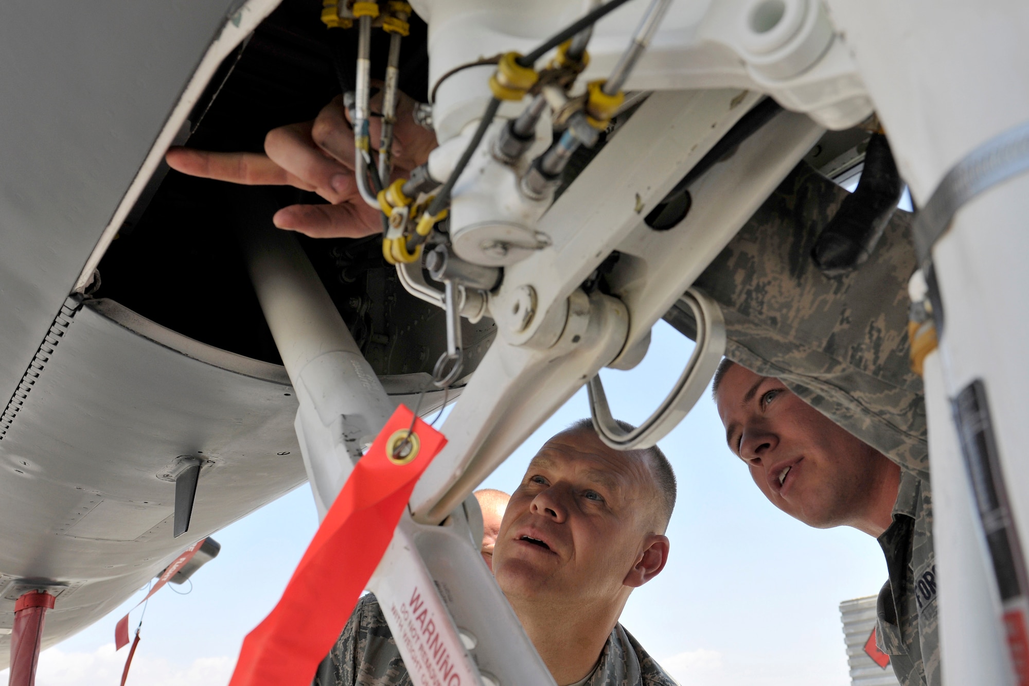 Chief Master Sergeant of the Air Force James A. Roy receives a tour of an F-15E Strike Eagle from Airman 1st Class Jordan Baker June 25, 2010, at Bagram Airfield, Afghanistan. Airman Baker is an F-15 crew chief assigned to the 455th Expeditionary Maintenance Group. (U.S. Air Force Photo/Staff Sgt. Christopher Boitz)