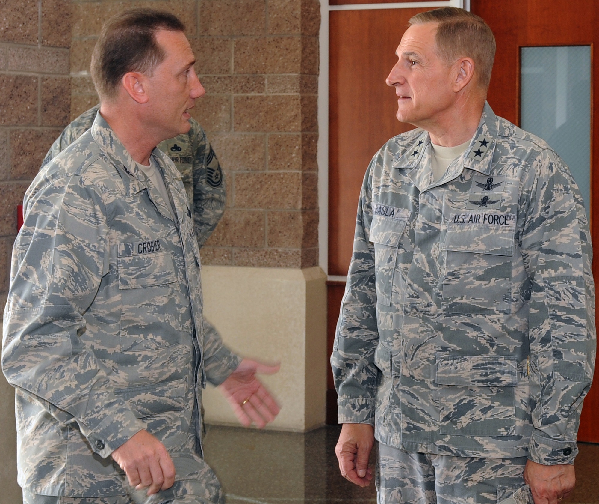 BUCKLEY AIR FORCE BASE, Colo. -- Maj. Gen. Michael Basla, Air Force Space Command vice commander, discusses space operations with Col. Clint Crosier, 460th Space Wing commander, during the general's visit to Buckley June 4.  (U.S. Air Force photo by Airman 1st Class Manisha Vasquez)