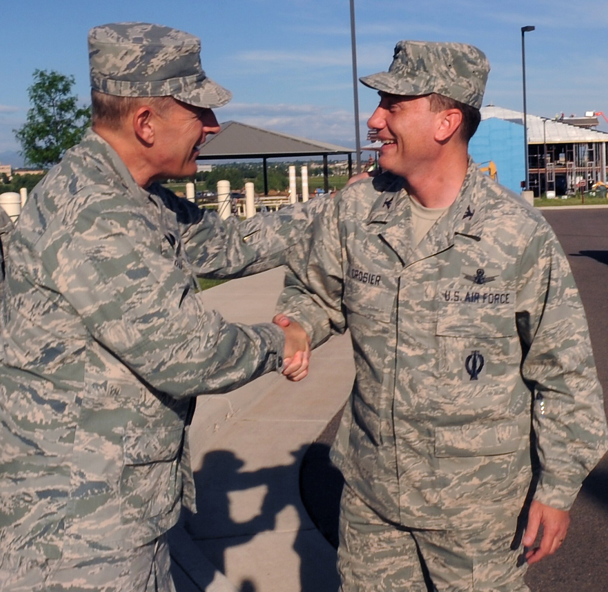BUCKLEY AIR FORCE BASE, Colo. -- Maj. Gen. Michael Basla, Air Force Space Command vice commander, greets Col. Clint Crosier, 460th Space Wing commander, as he arrives at Buckley June 4. (U.S. Air Force photo by Airman 1st Class Manisha Vasquez)