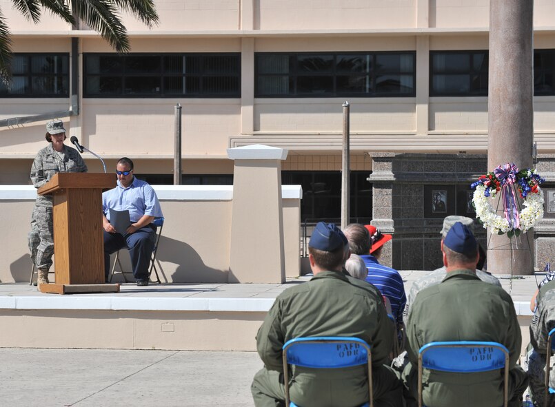PATRICK AIR FORCE BASE, Fla. -  Col. Charlene Nelson, commander of the 920th Maintenance Squadron here, speaks on behalf of the 920th Rescue Wing commemorating the men who lost their lives in the Khobar Towers bombing in 1996. ?We honor these men for their families ? we will never forget their sacrifice,? Col. Nelson said. Family, friends and airmen gathered to remember the 14th anniversary of that day. (U.S. Air Force Photo/ John Connell) 