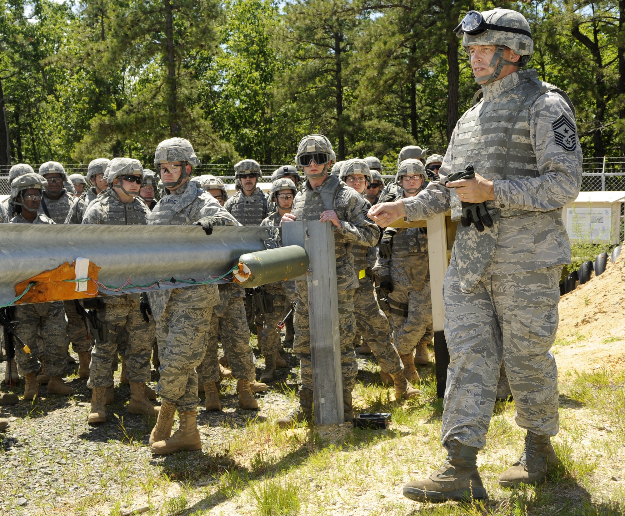 Chief Master Sgt. Robert Tappana, Air Education and Training Command command chief, addresses members of Joint Base McGuire-Dix-Lakehurst during an improvised explosive device training class at Joint Base McGuire-Dix-Lakehurst’s Camp Victory June 15. Tappana visited June 14 through 17 to gain first-hand knowledge of the Air Force predeployment training conducted here. (U.S. Air Force photo/Carlos Cintron)