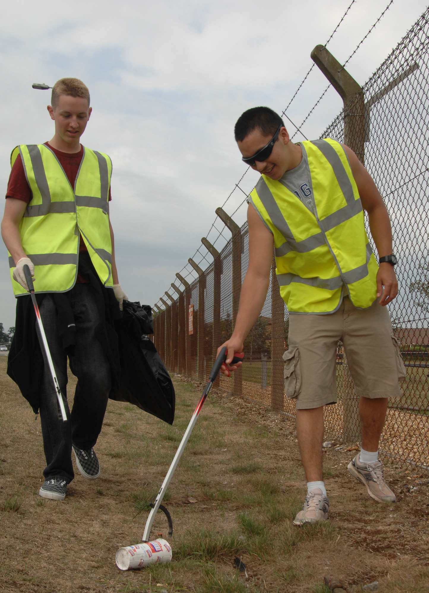 Airmen 1st Class Joshua Long and Nicholas Caudillo of the 48th Equipment Maintenance Squadron pluck a discarded cup from the side of the road outside RAF Lakenheath, England, during a Litter Pick June 26. Thirty bags of litter were removed during the cleanup. (U.S. Air Force photo/Senior Airman David Dobrydney)
