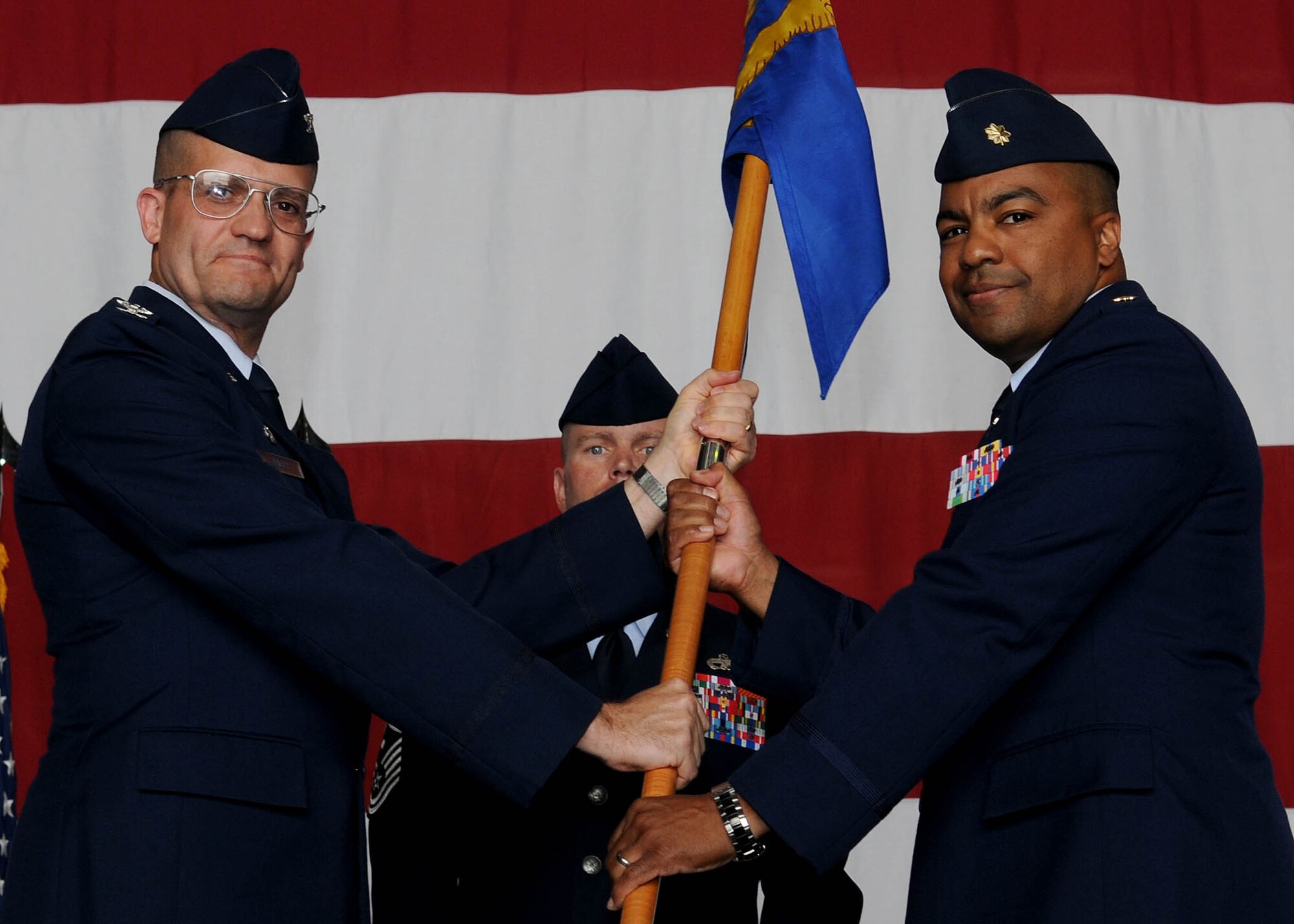 Maj. Michael Clancy (right) accepts command of the 39th Maintenance Squadron from Col. Eric Gates, 39th Maintenance Group commander, during the change of command ceremony Monday, June 28, 2010 at Incirlik Air Base, Turkey.  Prior to taking command of the 39th MXS, Major Clancy was the commander of the 18th Component Maintenance Squadron, Kadena Air Base, Japan.  The change of command ceremony is an Air Force tradition that gives unit Airmen the opportunity to view their new leader take command.  (U.S. Air Force photo/Senior Airman Ashley Wood)