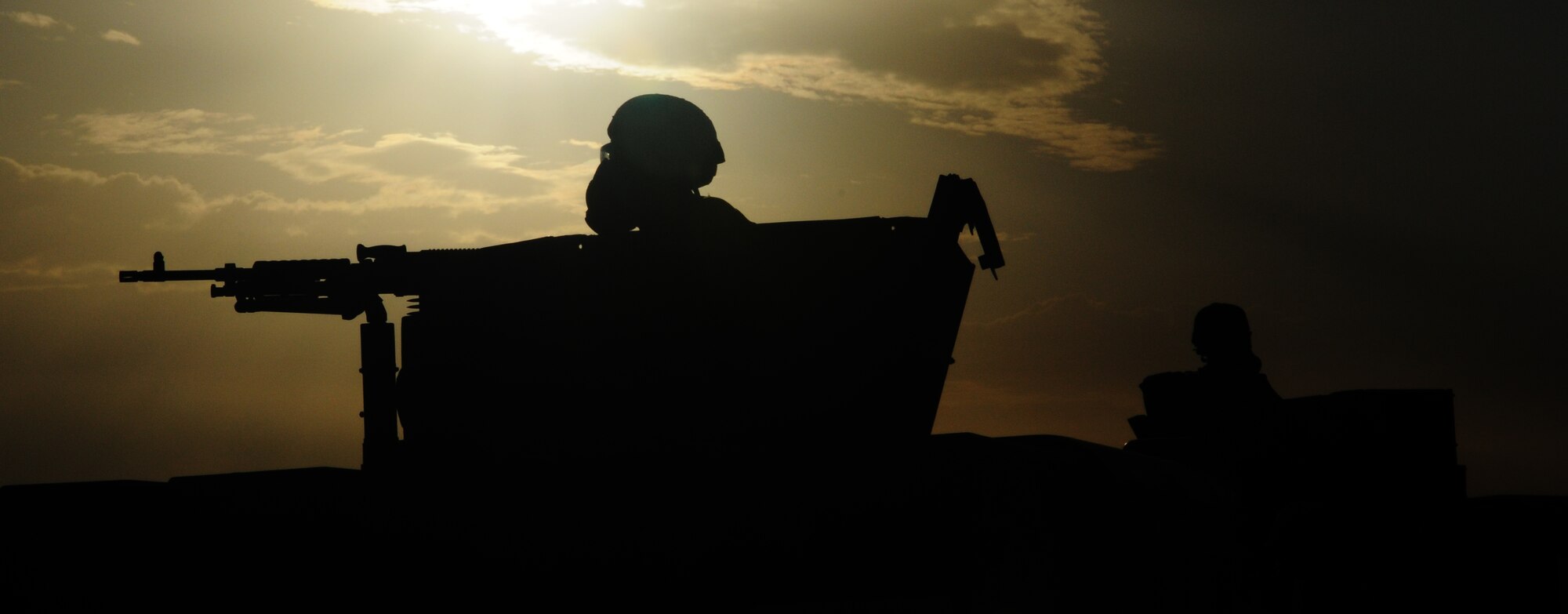 Humvee gunners from the 39th Security Forces Squadron stand ready for action during an exercise Thursday, June 24, 2010 at Incirlik Air Base, Turkey. Exercises are held often throughout the Air Force to keep Airmen trained and ready for real-world situations. (Air Force photo/ Senior Airman Alexandre Montes)