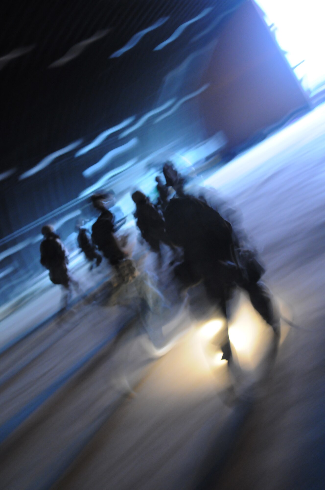 Airmen from the 39th Security Forces Squadron move with a sense of purpose after a simulated fire is announced during an early morning exercise Thursday, June 24, 2010 at Incirlik Air Base, Turkey. Exercises are held often throughout the Air Force to keep Airmen trained and ready for real-world situations. (Air Force photo/ Senior Airman Alexandre Montes)