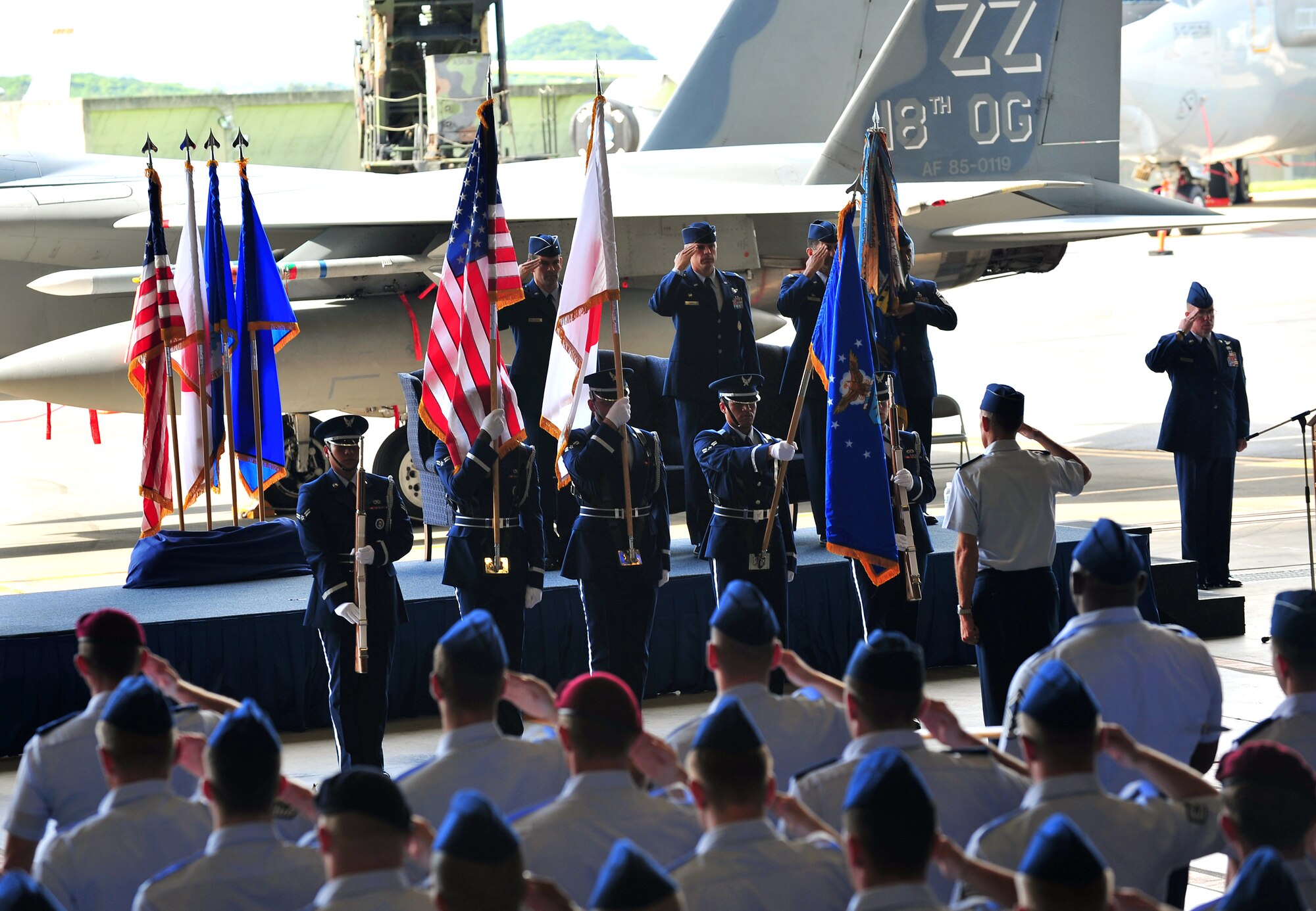 The 18th Operations Group change of command begins as Kadena Airmen salute the American flag June 28. Col. David Nahom assumes command as Col. Ronald Banks relinquishes command.
(U.S. Air Force photo/Tech. Sgt. Rey Ramon)      