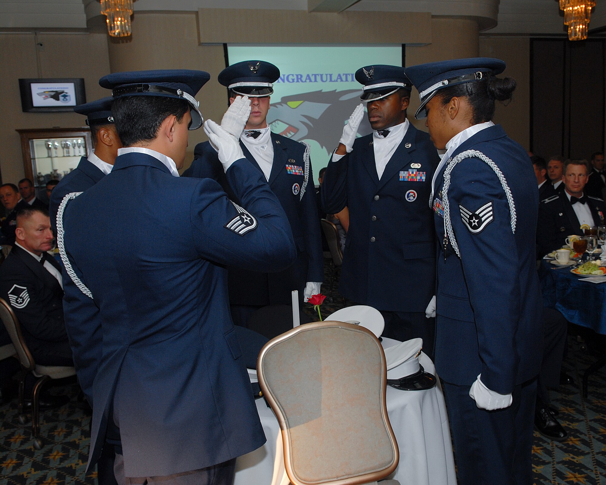 KUNSAN AIR BASE, Republic of Korea -- Wolf Pack Honor Guardsmen honor Prisoners of War and Missing in Action service members during a Senior Non-commissioned Officer Promotion Recognition banquet June 26. The purpose of the banquet was to celebrate and recognize the 33 new master sergeant selects of the Wolf Pack. (U.S. Air Force photo/Senior Airman Roy Lynch)