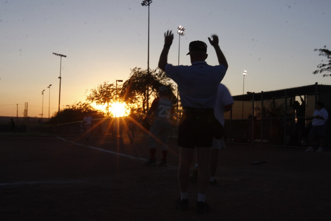 An umpire signals an out during the Commanding General's Intramural Softball League All-Star game June 30 at the Combat Center's Felix field.