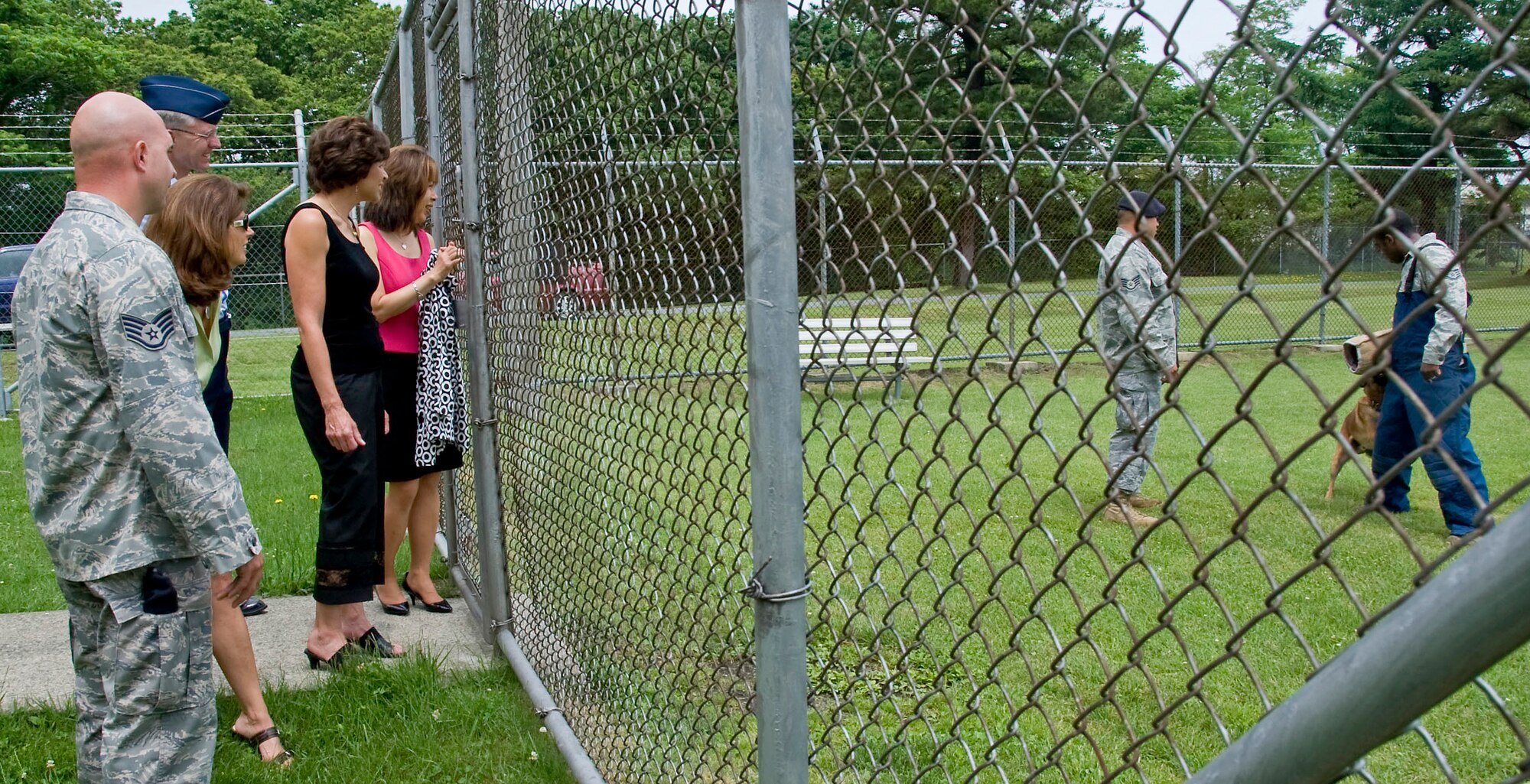 MISAWA AB, Japan?Teresa Rice, wife of Lt. Gen. Edward Rice Jr., U.S. Forces Japan and 5th Air Force commander, watches a demonstration by the 35th Security Forces Squadron dog handlers, June 28. Dog handlers work with their canines focusing on training and detection of explosives or drugs in a variety of different environments. (U.S. Air Force photo/Staff Sgt. Araceli Alarcon) 