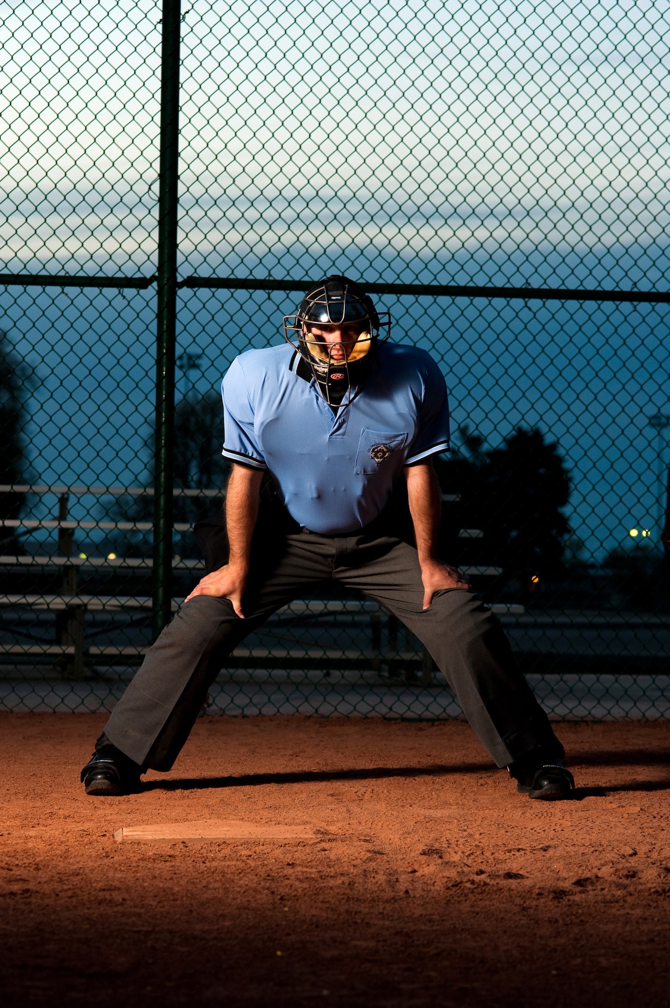 BUCKLEY AIR FORCE BASE, Colo. --  "A friend of mine was an umpire and knew I liked baseball," says Staff Sgt. Larry Bouchard, Air Force Intelligence, Surveillance, and Reconnaissance Agency Detachment 45 Satellite Operations non-commissioned officer-in-charge. "I tried it out and liked it so much that I continued with it." Sergeant Bouchard demonstrates an umpire's stance near the batter's box at the base softball field May 9. (U.S. Air Force photo by Staff Sgt. Kathrine McDowell)