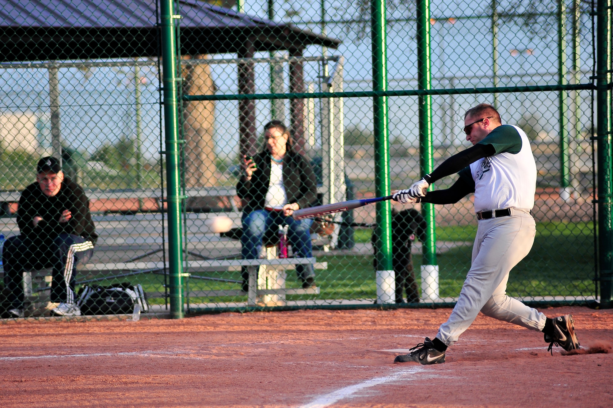 BUCKLEY AIR FORCE BASE, Colo. -- Staff Sgt. Larry Bouchard, Air Force Intelligence, Surveillance, and Reconnaissance Agency Detachment 45 Satellite Operations non-commissioned officer-in-charge,  swings in the batter's box during a base softball game May 16. Sergeant Bouchard not only enjoys the sport, he is also a certified baseball umpire. (U.S. Air Force photo by Staff Sgt. Kathrine McDowell)