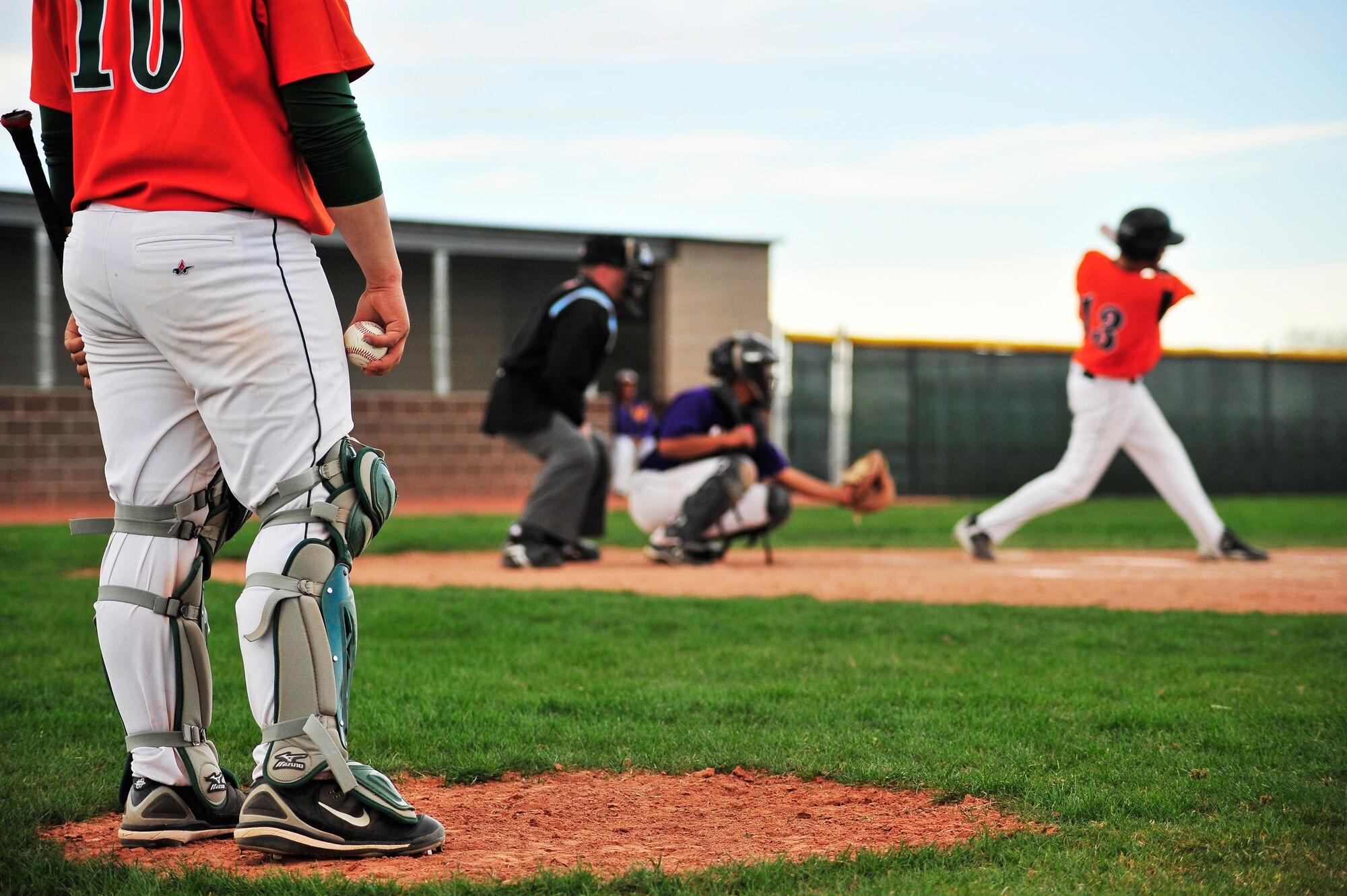 DENVER, Colo. -- Staff Sgt. Larry Bouchard, Air Force Intelligence, Surveillance, and Reconnaissance Agency Detachment 45 Satellite Operations non-commissioned officer-in-charge, watches a swing and a miss during a local baseball game May 1. Sergeant Bouchard began umpiring games at the suggestion of a co-worker who also loved the sport and hasn't stopped since. (U.S. Air Force photo by Staff Sgt. Kathrine McDowell)