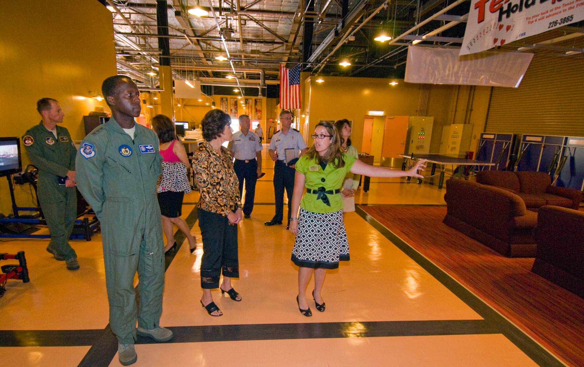 MISAWA AIR BASE, Japan -- Amy O’Grady, Airmen’s Center director, showcases the $769,000 Airmen’s Center to Lt. Gen. Edward A. Rice Jr., U.S. Forces Japan and 5th Air Force commander, and his wife, Teresa, during their visit to the base. The facility, renovated last winter, provides a social environment for the base’s junior enlisted corps.  (U.S. Air Force photo/ Senior Airman Jessica Lockoski) 