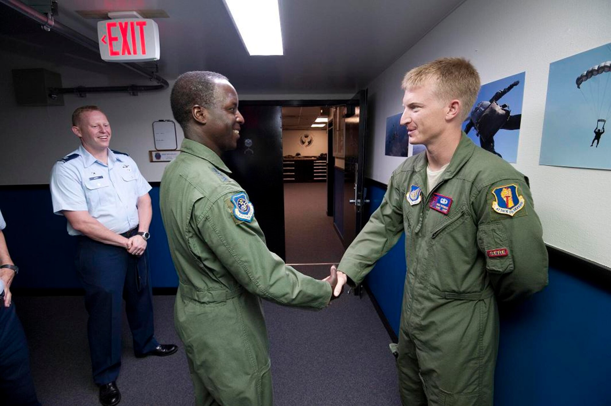 MISAWA AIR BASE, Japan -- Lt. Gen. Edward Rice Jr., U.S. Forces Japan and 5th Air Force commander, shakes hands with Staff Sgt. Benjamin Thomas, 35th Operations Support Squadron survival, evasion, resistance and escape specialist, at the 35th OSS June 28. Sergeant Thomas gave General Rice a SERE briefing for his flight later that day. (U.S. Air Force photo/Staff Sgt. Samuel Morse)