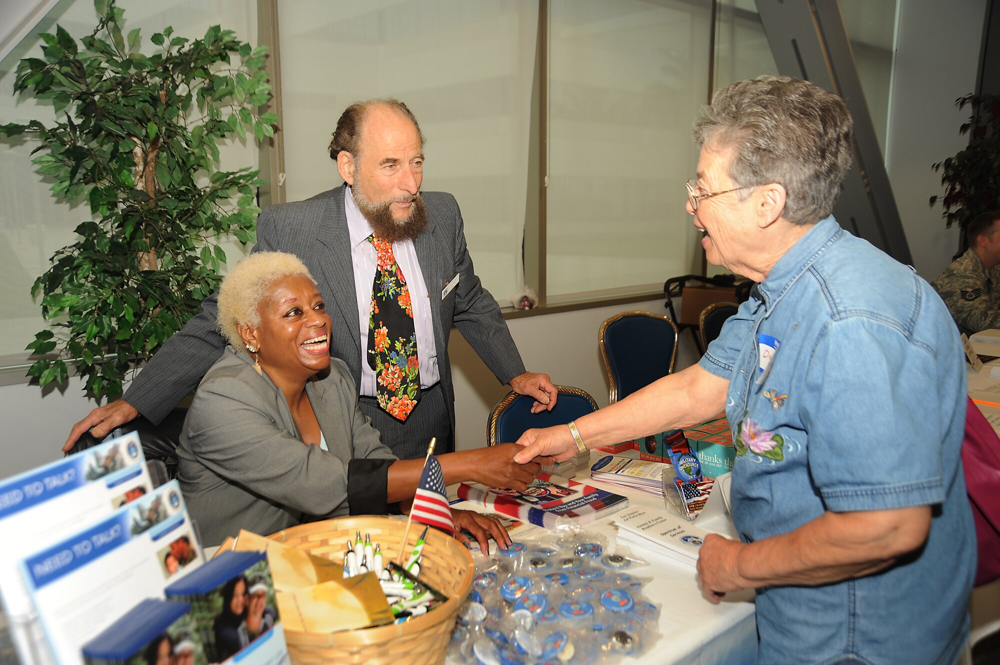A retiree talks to representatives from the Airmen and Family Readiness Center about benefits available to her at the annual Retiree Expo, June 26.  The expo was held in the Gordon Conference Center and featured speakers and information booths. (Photo by Joe Juarez)