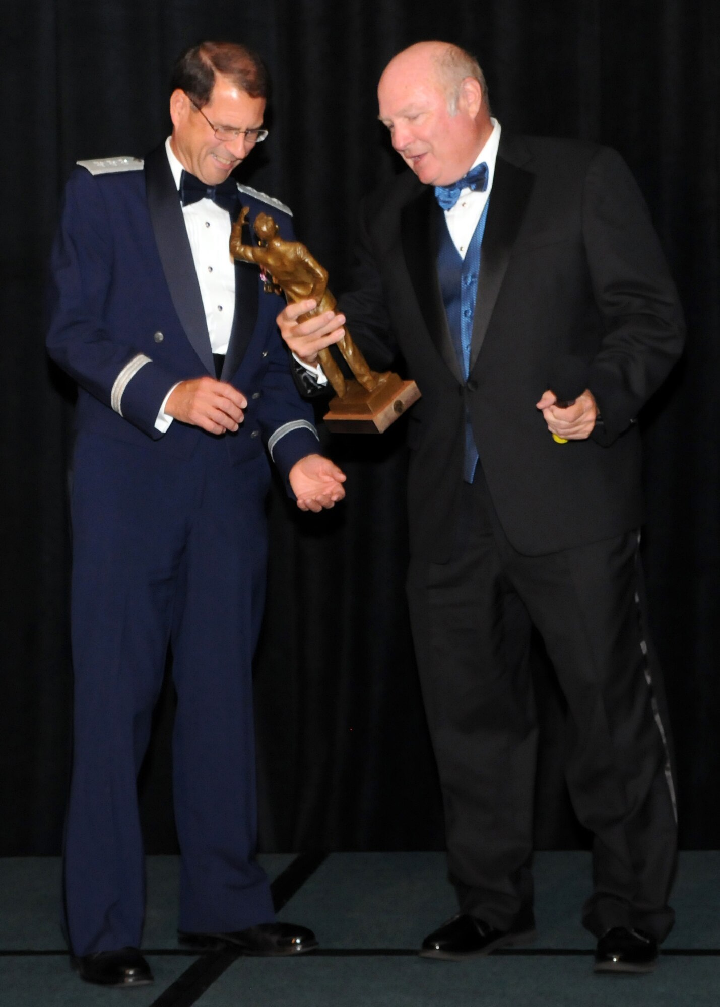 Lt. Gen. Tom Sheridan, SMC commander, accepts  the General Bernard A. Schriever  Award from the chapter’s  Chairman of the Board, Retired Maj. Gen. Thomas Taverney, at the 36th annual AFA Salute to SMC, June 25. Hosted by AFA’s General Bernard A. Schriever chapter, this year’s awards event was held at the Los Angeles Airport Marriott. (Photo by Jim Gordon)