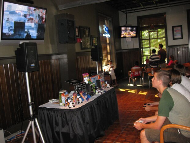 Adam Pollard, left, Derek Cormier and Ian Dahan, right, compete in a "Call of Duty: Modern Warfare 2"  tournament at the Charleston Club on Joint Base Charleston, S.C., June 26, 2010. The charge to compete was $5 and included food and drinks. Prizes such as gift certificates to the base exchange, restaurants and video game console accessories were awarded to the winners of the tournament. (U.S. Air Force photo/Airman 1st Class Haleigh Greer)