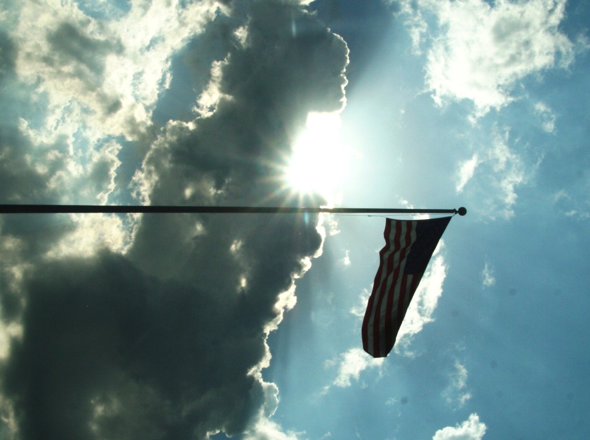 The American flag flies in front of the Air Mobility Command Headquarters at Scott Air Force Base, Ill., June 27, 2010. Air Mobility Command's mission is to provide global air mobility ... right effects, right place, right time. The command also plays a crucial role in providing humanitarian support at home and around the world. AMC Airmen--active duty, Air National Guard, Air Force Reserve and civilians--provide airlift and aerial refueling for all of America's armed forces. (U.S. Air Force Photo/Master Sgt. Scott T. Sturkol) 