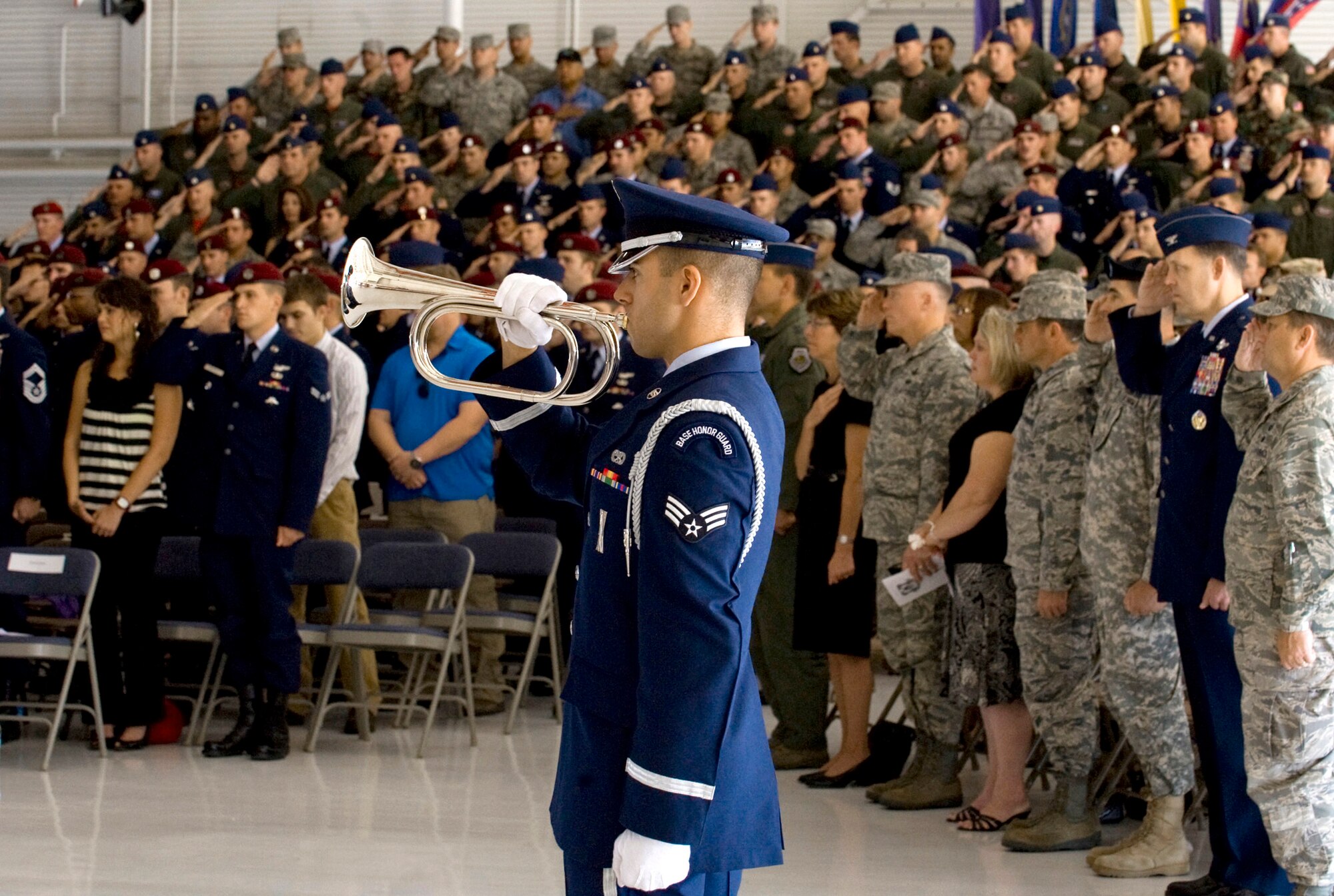 Senior Airman Anthony Berardocco plays "Taps" during a memorial ceremony for 1st Lt. Joel Gentz and Staff Sgt. David Smith June 18, 2010, at Nellis Air Force Base, Nev.  The two were among four Airmen killed and three wounded when an HH-60G Pave Hawk crashed during a mission in southeastern Afghanistan June 9. (U.S. Air Force photo/Airman 1st Class Jamie Nicley)
