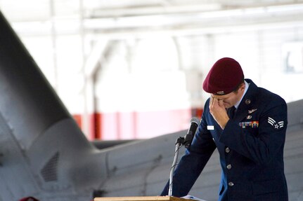 Senior Airman Joshua Degenhardt pays his final respect to 1st Lt. Joel Gentz and Staff Sgt. David Smith during a memorial ceremony June 18, 2010, at Nellis Air Force Base, Nev.  Lieutenant Gentz was a combat rescue officer assigned to the 58th Rescue Squadron and Sergeant Smith was a helicopter flight engineer assigned to the 66th Rescue Squadron.   (U.S. Air Force photo/Lawrence Crespo)

