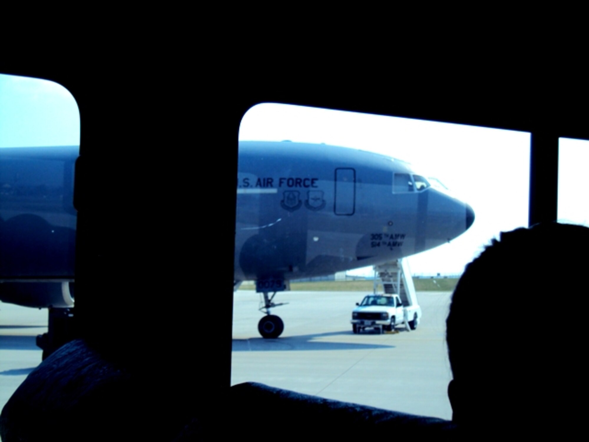 Deployed Airmen ride aboard a bus driven by an aerial porter from the 380th Expeditionary Logistics Readiness Squadron's Air Terminal Operations Center at a non-disclosed base in Southwest Asia on June 24, 2010. Aerial porters, or air transportation Airmen, deployed to the 380th ELRS of the 380th Air Expeditionary Wing are deployed from the 89th Aerial Port Squadron at Joint Base Andrews, Md. (U.S. Air Force Photo/Master Sgt. Scott T. Sturkol)