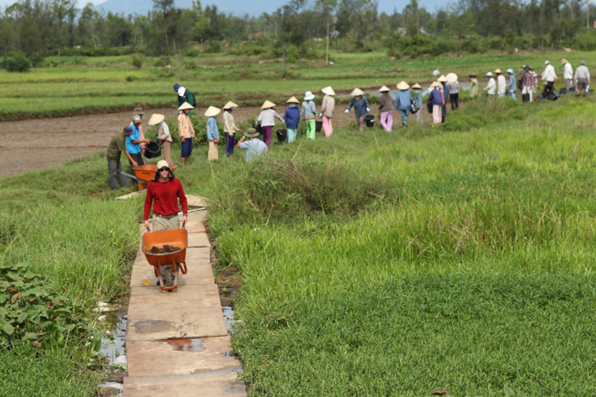 Spc. Andrew Childs pushes a wheelbarrow filled with excavated earth during a recovery mission in the Quang Nam province, Socialist Republic of Vietnam. Childs was a recovery Noncommissioned Officer on a 13-person Joint POW/MIA Accounting Command recovery team attempting to recover evidence of Americans lost during the Vietnam War. JPAC's worldwide mission is to achieve the fullest possible accounting of all American's lost during the nation's previous conflicts. (JPAC photo by Mr. Jason Kaye/Released)