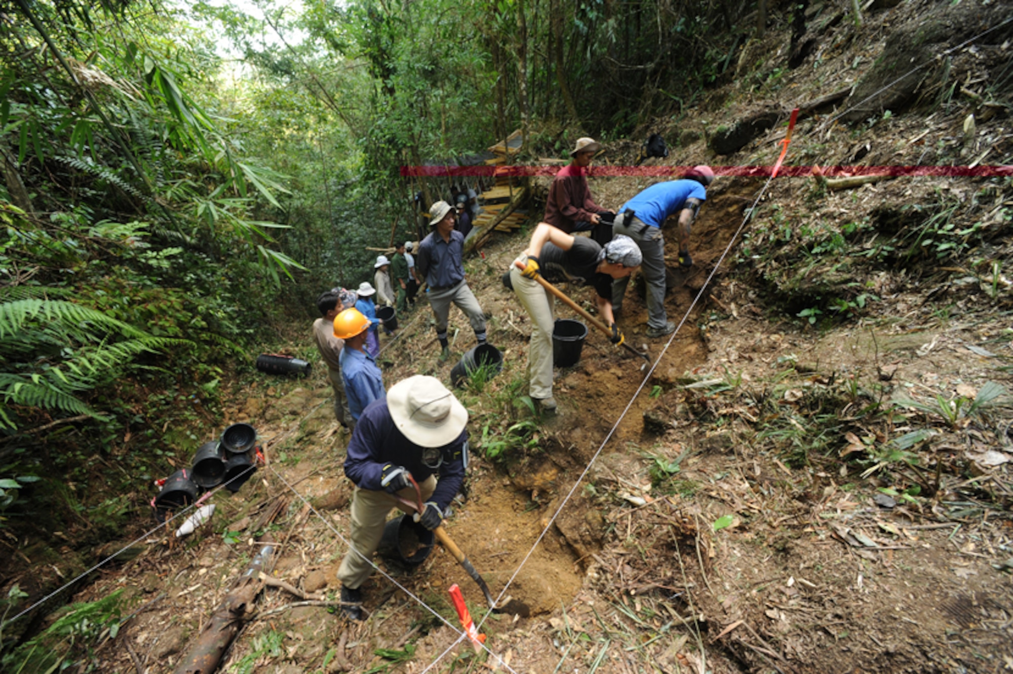 Joint POW/MIA Accounting Command and Vietnamese workers excavate a 4x4 meter unit at a recovery site in the Thua Thien-Hue province, Socialist Republic of Vietnam. Four recovery teams searched for four missing individuals associated with Vietnam War aircraft losses during the 40 day mission. The mission of the JPAC is to achieve the fullest possible accounting of all Americans missing as a result of the nation's past conflicts. (JPAC photo by U.S. Air Force Staff Sgt. Aaron Allmon/Released)