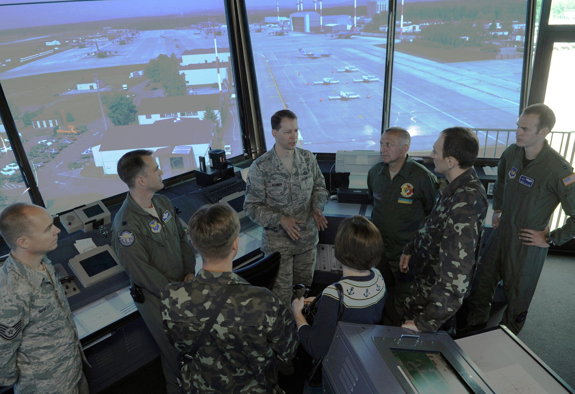 Master Sgt. Roy Wanner gives a tour of the air traffic control tower to Ukrainian air force members June 23, 2010, during a visit to Ramstein Air Base, Germany. The goal of the Ukrainian visit was to help advance military interoperability and build international partnerships. Sergeant Wanner is the 86th Operations Support Squadron air traffic control complex chief controller. (U.S. Air Force photo/Senior Airman Caleb Pierce)