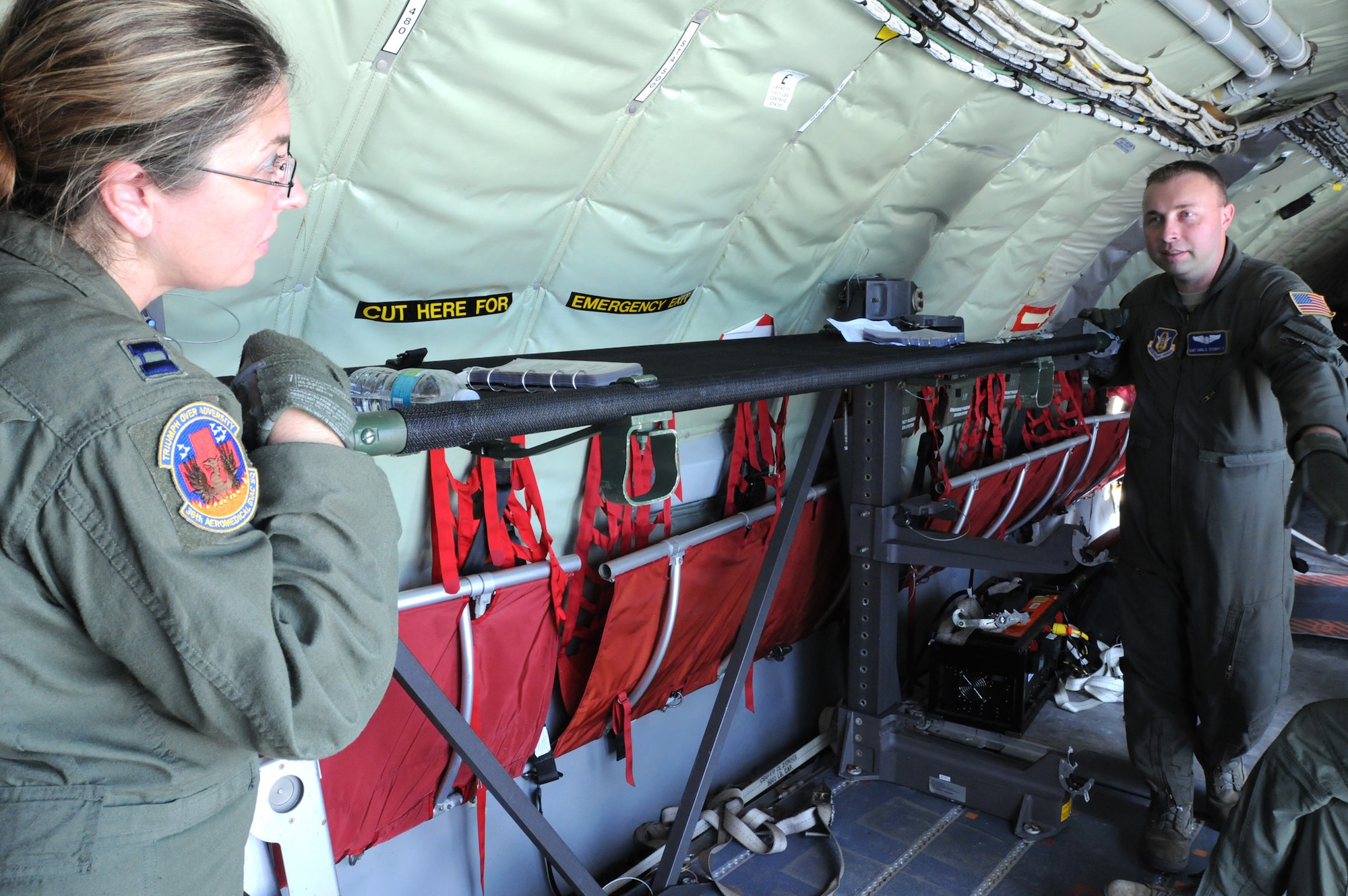 Staff Sgt. Carl Stewart II (right), 459th Aeromedical Evacuation Squadron, explains to Capt. Constance Mackus, 36th AES, how to put together a Patient Support Pallet, on a KC-135R Stratotanker in Melbourne, Fla, June 26. PSPs are used aboard aircraft like the KC-135R, the C-17 Globemaster III and the C-130 to allow aeromedical evacuation specialists to administer care to patients during flight. Sergeant Stewart and Capt. Mackus joined other Airmen from the 36th AES and the 43rd AES in a three-day Total Force aeromedical evacuation training miission here. (U.S. Air Force photo/Staff Sgt. Steve Lewis)