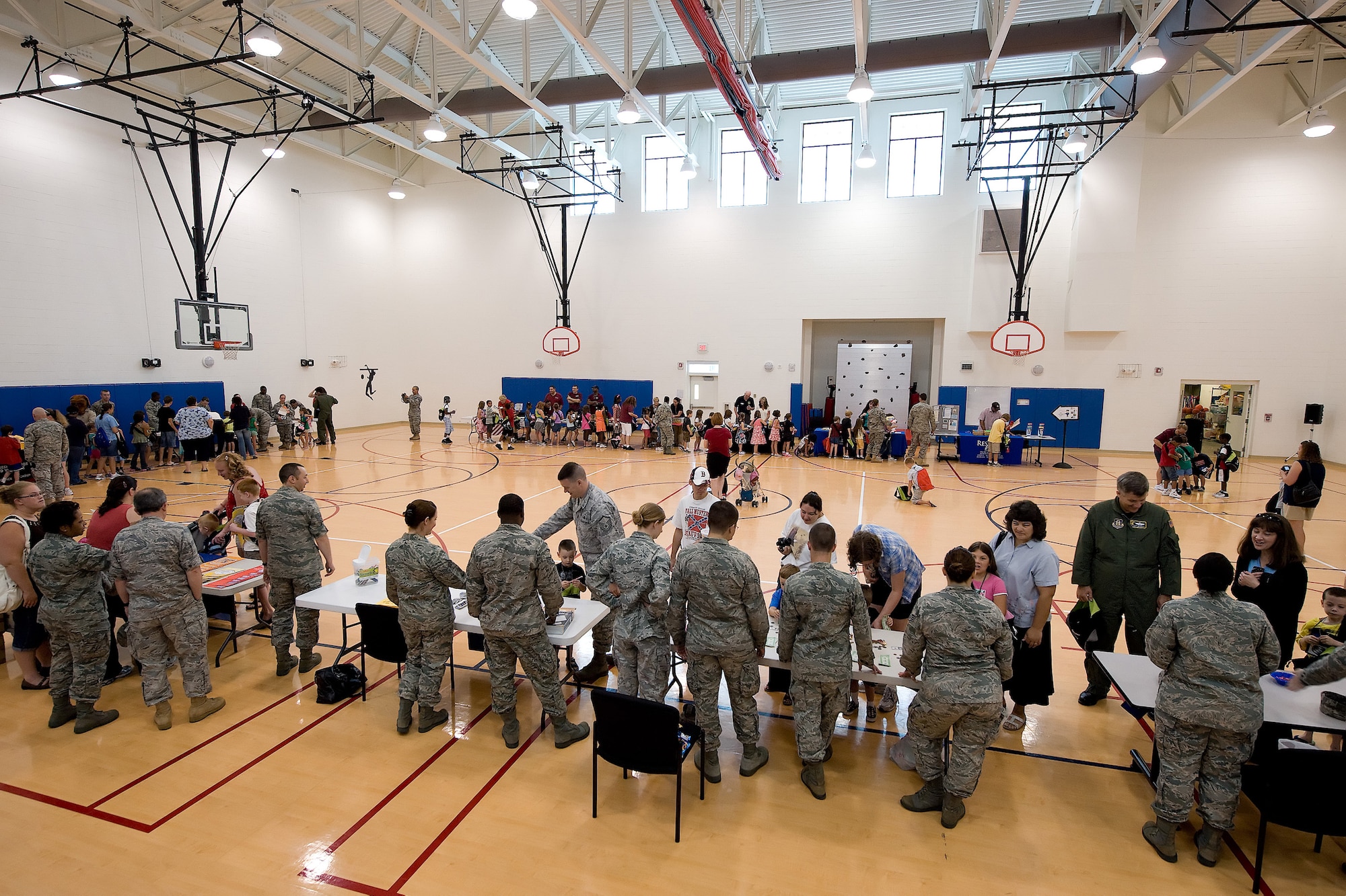 Team Dover processes through the Children's Mobilitiy Line June 25, 2010. The Children's Mobility Line has run for six years and works with more than 300 children a year. Its purpose is to educate the children on the processes of pre-deployment and show them they serve too. (U.S. Air Force photo by Jason Minto/Released)