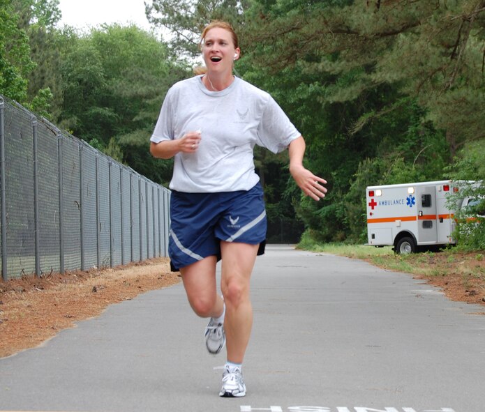 Maj. Shannon Mann, 916th Public Affairs Officer, completes the wing warrior run in May. In this commentary she offers insight for preparing for the new Fit to Fight standards. (USAF photo by TSgt. Scotty Sweatt, 916ARW/PA)
