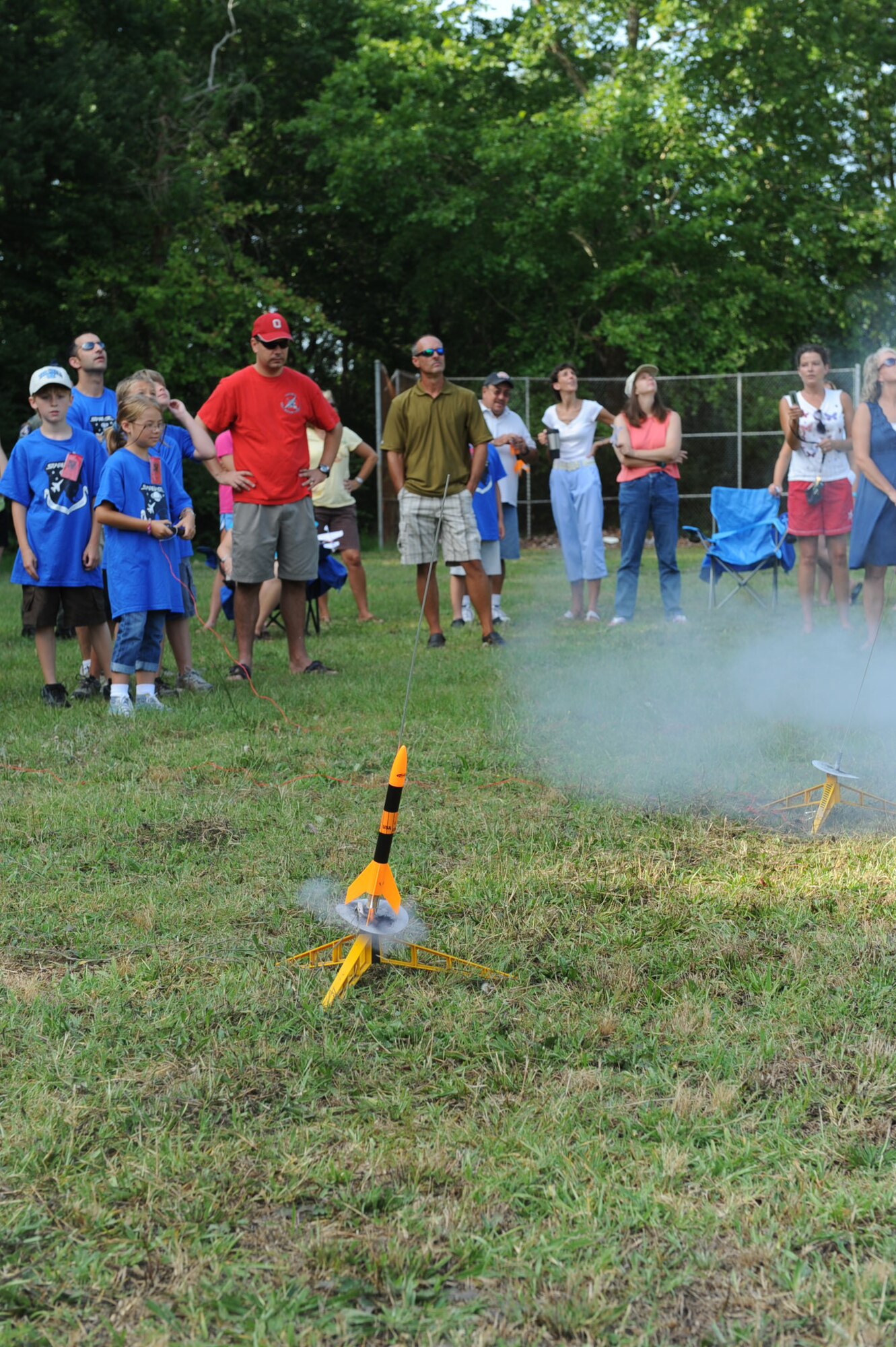 GOLDSBORO, N.C. -- Parents watch as their children launch rockets they built while participating in Science and Technology Academies Reinforcing Basic Aviation and Space Exploration program on the Greenwood Middle School grounds June 25, 2010. On a typical day the students spent their mornings in the classroom learning about math and science and in the afternoon demonstrated their understanding through a series of activities. (U.S. Air Force photo/Senior Airman Gino Reyes)