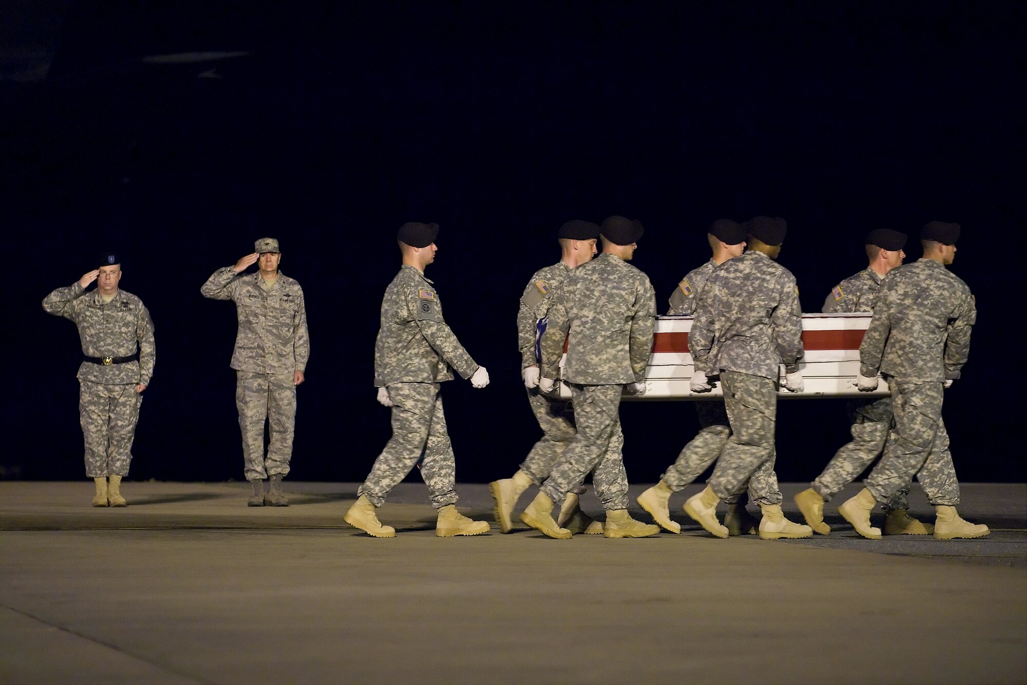 A U.S. Army carry team transfers the remains of Army Spc. Jared C. Plunk, of Stillwater, Okla., at Dover Air Force Base, Del., June 26. (U.S. Air Force photo/Roland Balik)