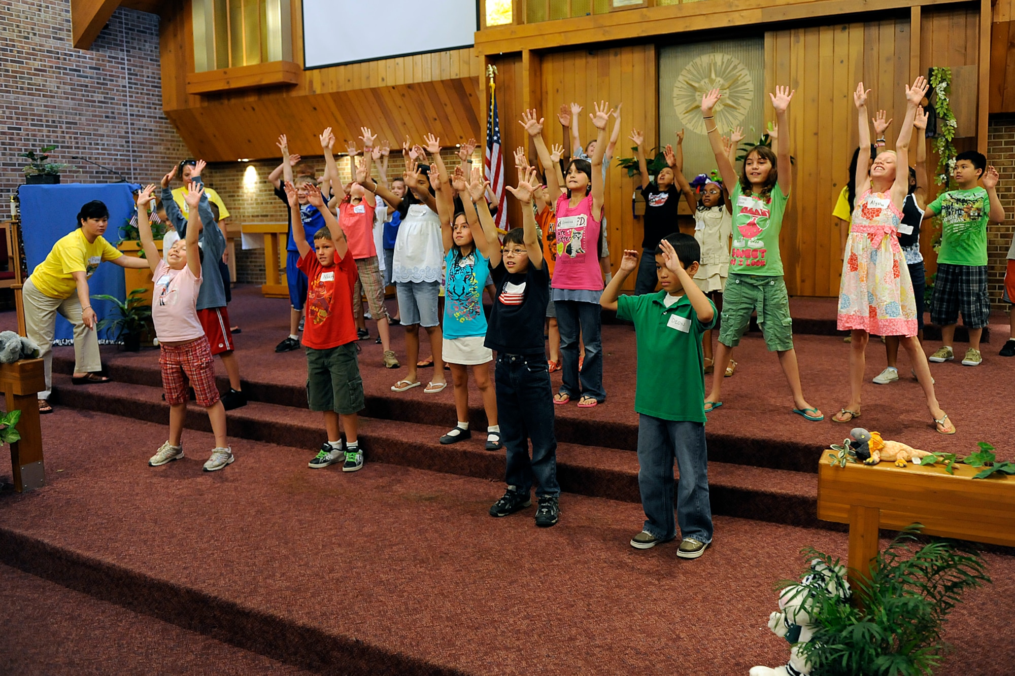 A record number of children ages 3 to 12 participated in the annual Vacation Bible School at Peterson Chapel on Peterson Air Force Base June 21 to 25. The children prepared a singing and dancing tribute to their military parents to end the week. (U.S. Air Force photo/Larry Hulst)