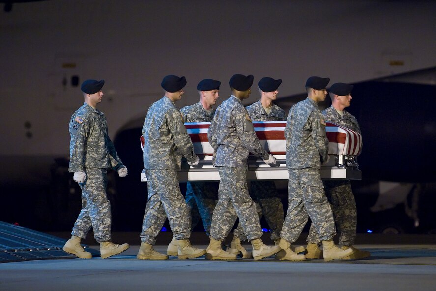 A U.S. Army carry team transfers the remains of Army Sgt. Nathan W. Cox, of Fremont, Calif., at Dover Air Force Base, Del., June 26. (U.S. Air Force photo/Roland Balik)